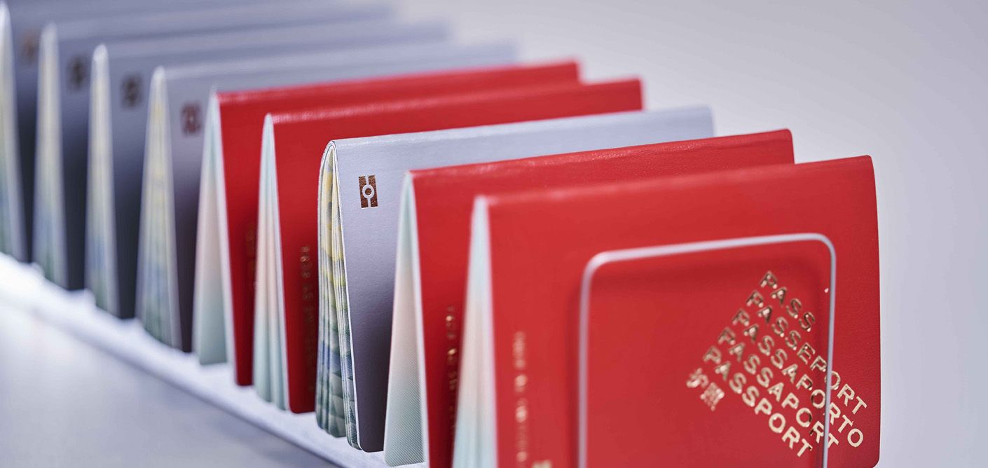 Passport documents lined up in a stand
